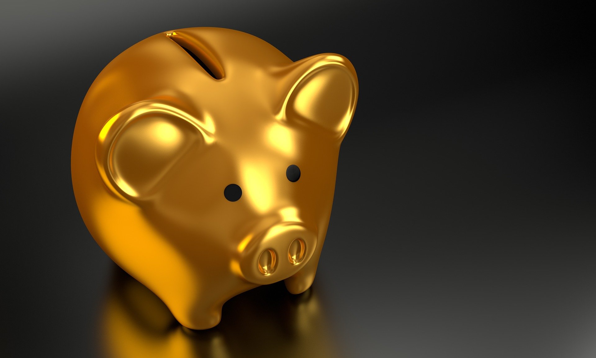 FGTS retido: imagem de um cofre de porquinho dourado sobre fundo preto